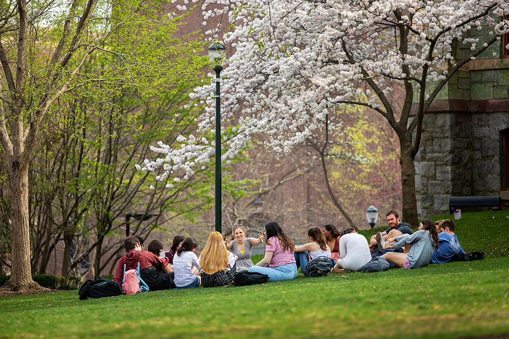 Students on the lawn in the spring