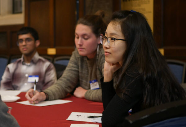 Inaugural Fellows sitting at table