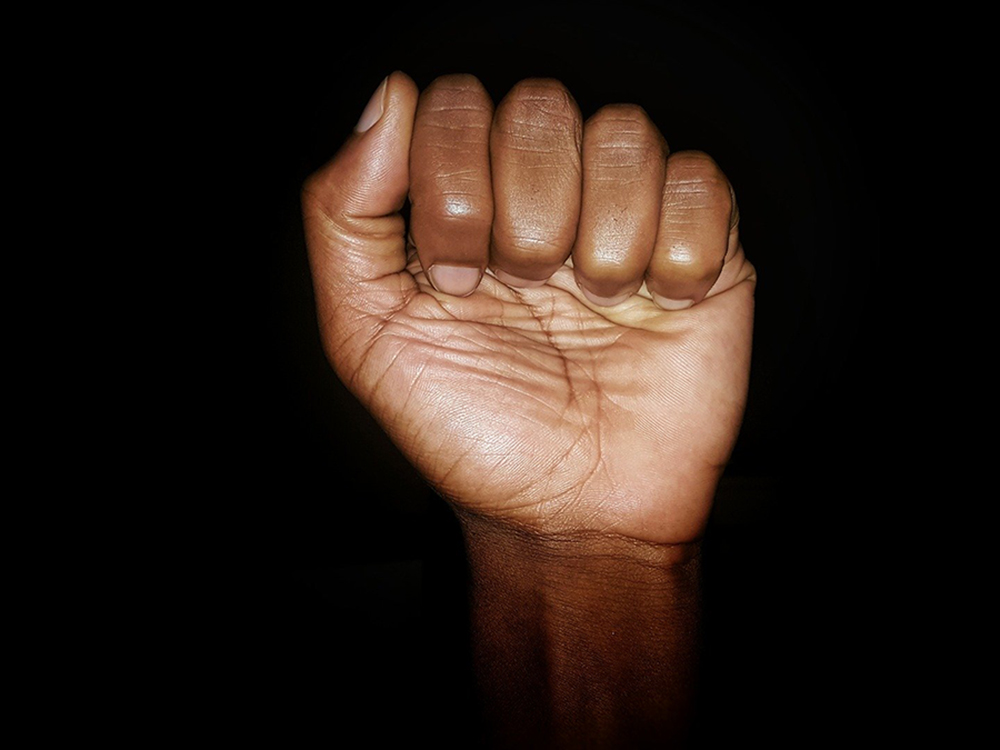 black hand in a fist