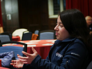 Penn student shares her views with others at her table.
