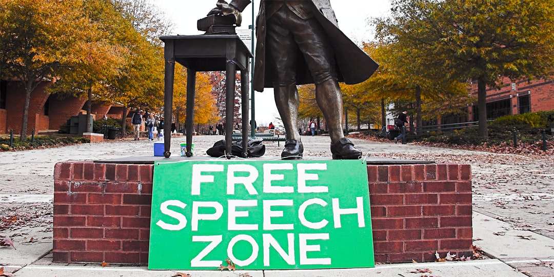 Free Speech Zone sign in-front of statue