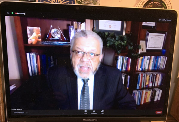 Police Commissioner Charles Ramsey on computer screen talking during event on police reform
