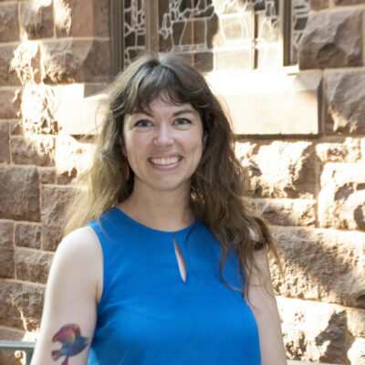 Sarah Ropp standing against stone building