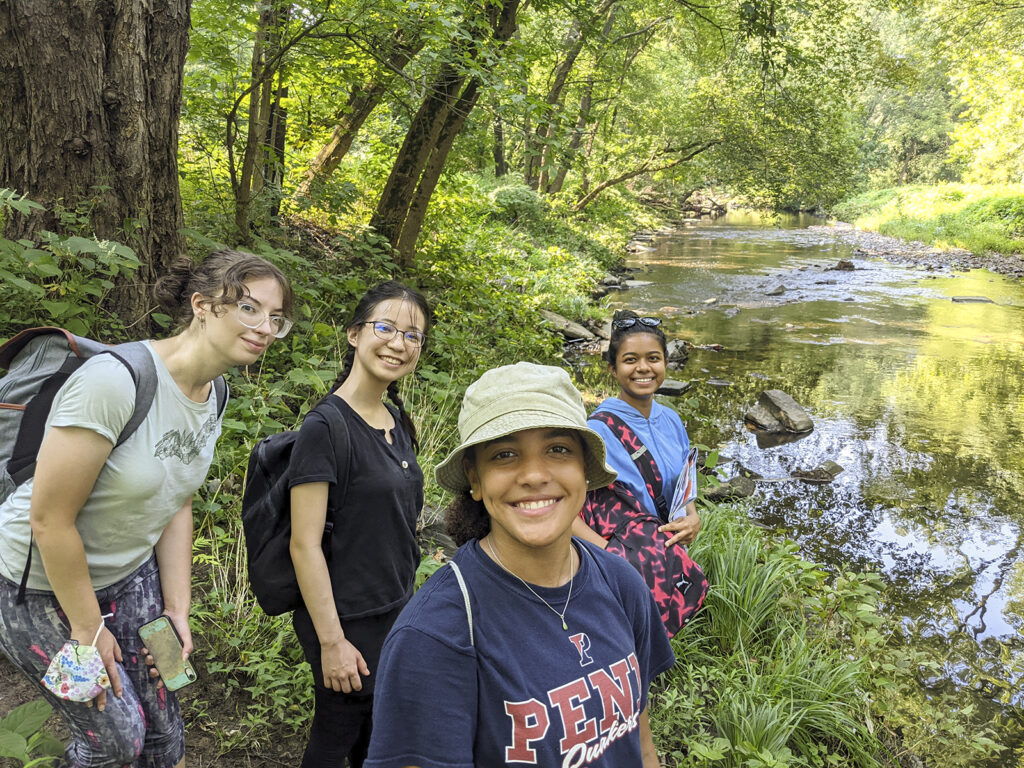 Anna Balfanz, Ayana Shirai, Mya Gordon and Yasmin Abdul Razak along the banks of Cobbs Creek