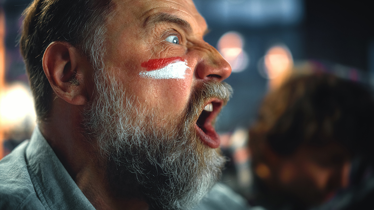 man with face paint shouting