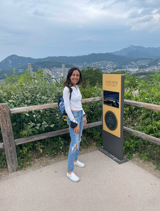 student standing by plaque in Naksan Park