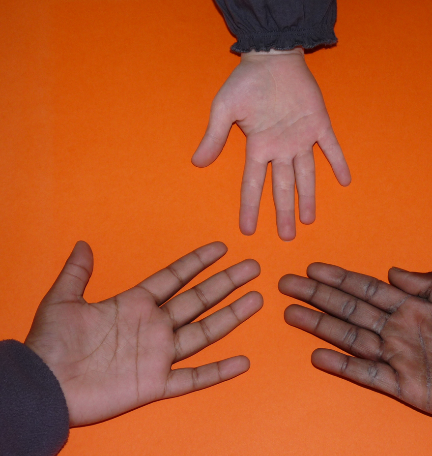 three hands outstretched towards each other