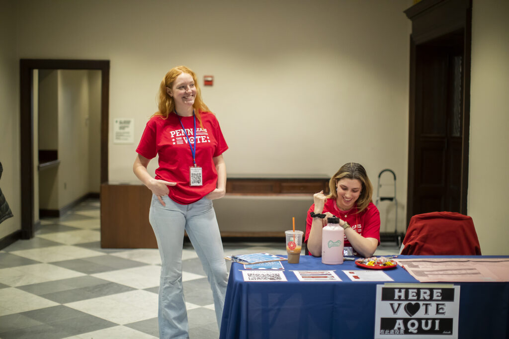 Elizabeth Ford and Whitney Clarfield volunteer with PLTV inside of Houston Hall.