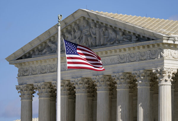 An American flag waves in front of the Supreme Court building on Capitol Hill in Washington, on Nov. 2, 2020. The Supreme Court heard oral arguments in two cases that could decide the future of affirmative action in college admissions on Monday, Oct. 31, 2022, in Washington, D.C. (Image: AP Photo/Patrick Semansky, File)