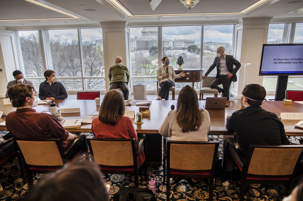 In last spring’s How Washington Really Works seminar, guest speaker Liz Fowler (center) gives students her insider view on helping write the Affordable Care Act as George Mason Professor Steven Pearlstein, (left), and Penn Vice Provost for Global Initiatives Ezekiel Emanuel (right) listen.