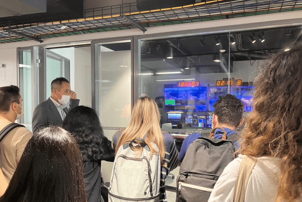 Bureau Chief Masaru Takagi shows Penn students around NHK's television studio.