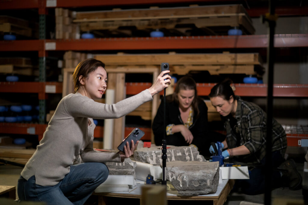 The team of students filming in the offsite warehouse