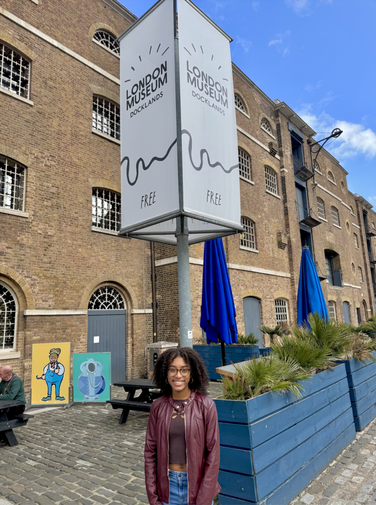 female student in front of Docklands Museum in the UK