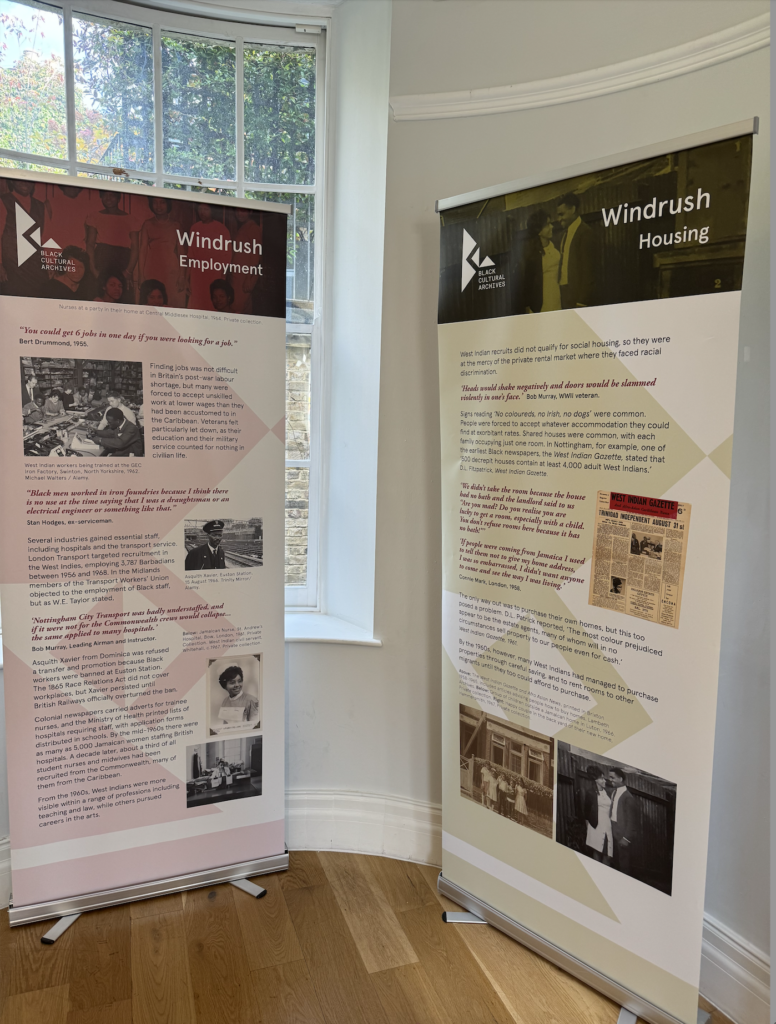 exhibition installation panels with information on history of employment and housing in Windrush, England at the Black Cultural Archives