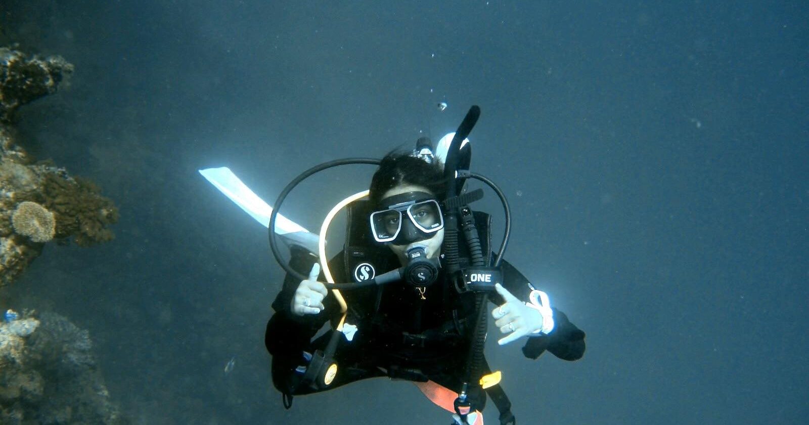 author of article scuba diving and looking at the camera