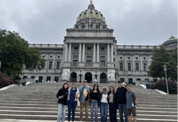 Political Empathy Lab Phase II research team in group photo standing on the steps of the state Capitol building in Harrisburg