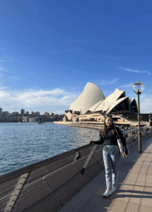 Author standing in front of Sydney Opera House